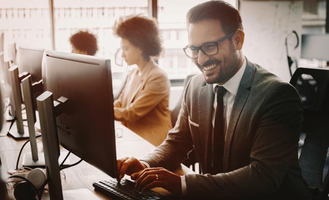 Happy worker at computer